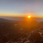Sunrise from rocky mountain summit